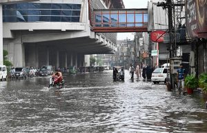 Vehicles navigate through inundated Poonch Road as daily life is disrupted following torrential rains in the provincial capital