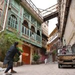 People play cricket in Mohalla Sethian, located in the heart of Peshawar’s old walled city, where seven historic havelis—architectural gems of the 18th and 19th centuries once owned by the Sethi merchant family—now stand in neglect