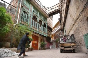 People play cricket in Mohalla Sethian, located in the heart of Peshawar’s old walled city, where seven historic havelis—architectural gems of the 18th and 19th centuries once owned by the Sethi merchant family—now stand in neglect