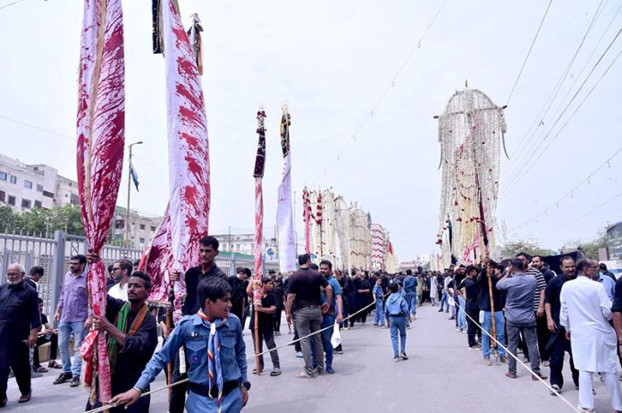 The main procession of 8th Muharram-ul-Haram passes through M.A. Jinnah Road