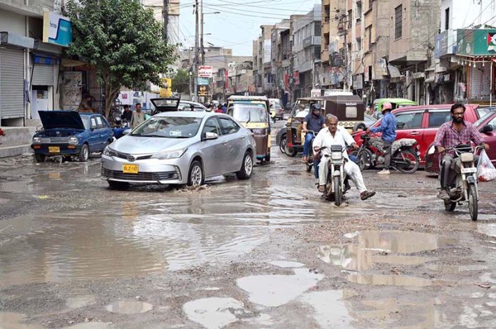 Vehicular traffic faces problems in movement due to stagnant sewage water on the road at Gulshan-e- Iqbal 13-D Area