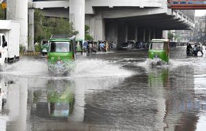 Vehicles navigate through inundated Poonch Road as daily life is disrupted following torrential rains in the provincial capital