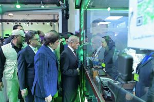 Prime Minister Muhammad Shehbaz Sharif interacts with information desk staff at Lahore Railway Station.