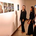 Visitors and art enthusiasts keenly observe artworks on display at the inaugural exhibition titled "Seeing", curated by Sarah Rajper at PNCA