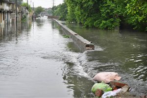 Vehicles navigate through inundated Poonch Road as daily life is disrupted following torrential rains in the provincial capital