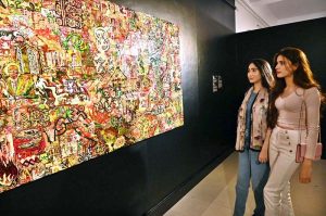 Visitors and art enthusiasts keenly observe artworks on display at the inaugural exhibition titled "Seeing", curated by Sarah Rajper at PNCA
