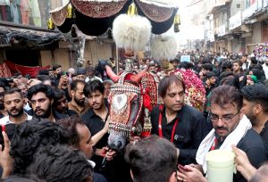 The main procession of 8th Muharram-ul-Haram passes through M.A. Jinnah Road