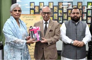 Chairperson Pakistan Academy of Letters, Dr. Najeeba Arif presents a book Adbiat to Federal Minister for National Heritage and Culture, Aurangzeb Khan Khichi during a special session in memory of the well-known writer Patras Bukhari at Academy of Letters.