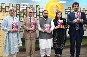 Chairperson Pakistan Academy of Letters, Dr. Najeeba Arif presents a book Adbiat to Federal Minister for National Heritage and Culture, Aurangzeb Khan Khichi during a special session in memory of the well-known writer Patras Bukhari at Academy of Letters.