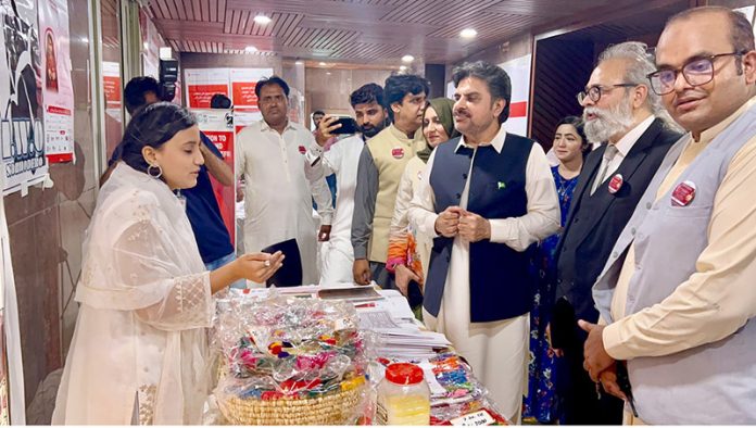 Sindh Minister for Energy, Planning, and Development, Syed Nasir Hussain Shah visits the stalls showcasing traditional and cultural items at a provincial-level awareness program on child and forced marriages organized by SPO along with civil society organizations from Khairpur and Jacobabad at the Pakistan Arts Council Karachi