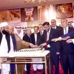 Federal Minister for National Food Security & Research, Rana Tanveer Hussain cutting a cake to celebrate the National Day ceremony of the Arab Republic of Egypt