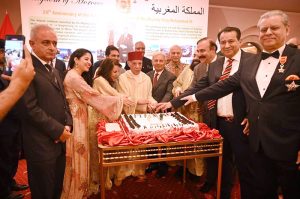 Federal Minister for National Food Security and Research, Industries and Production, Rana Tanveer Hussain along with The Ambassador of the Kingdom of Morocco and Mrs Mohamed Karmoune and other dignitaries cutting cake on the occasion of the Twenty Sixth Anniversary of the Accession to The Throne of King Mohammed VI of Morocco at a local hotel