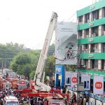Rescue workers struggle to extinguish a fire that broke out at Hafeez Center in Gulberg