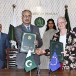 Dr. Kazim Niaz, Secretary Economic Affairs, and EU Ambassador, Dr. Riina Kionka, shaking hands after signing grant agreement between Pakistan and European Union