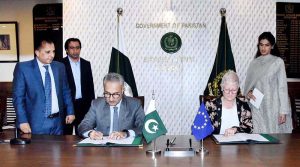 Dr. Kazim Niaz, Secretary Economic Affairs, and EU Ambassador, Dr. Riina Kionka, shaking hands after signing grant agreement between Pakistan and European Union