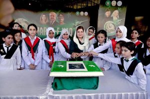 Parliamentary Secretary for Federal Education and Professional Training, Ms. Farah Naz Akbar cutting cake in connection with Marka-e-Haq and the 78th Independence Day of Pakistan celebrations at Lok Virsa organized by Pakistan Girls Guide Association (Islamabad chapter).