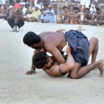 Wrestlers in action in traditional wrestling (Malakhra) during 282nd urs celebration of Hazrat Shah Abdul Latif Bhitai