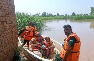 Rescue 1122 personnel evacuate residents from flood-hit areas to safer locations after the River Chenab overflowed, as rising water levels triggered by heavy rains and the opening of Indian floodgates crossed the danger mark.