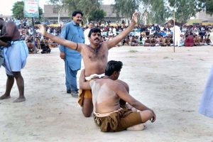 Wrestlers in action in traditional wrestling (Malakhra) during 282nd urs celebration of Hazrat Shah Abdul Latif Bhitai