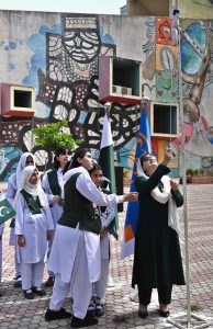 Parliamentary Secretary for Federal Education and Professional Training, Ms. Farah Naz Akbar cutting cake in connection with Marka-e-Haq and the 78th Independence Day of Pakistan celebrations at Lok Virsa organized by Pakistan Girls Guide Association (Islamabad chapter).