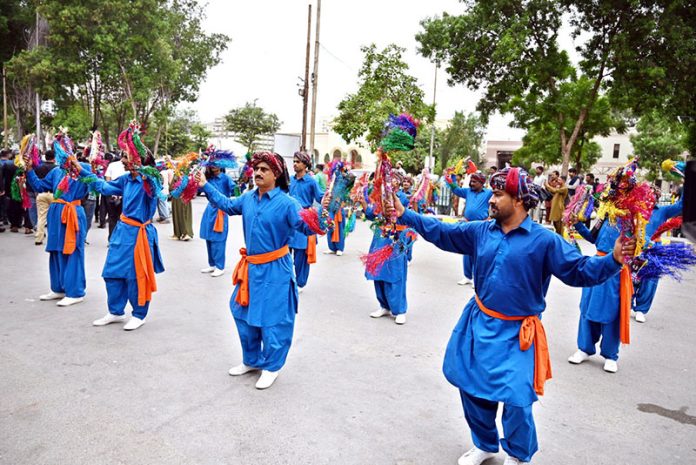Sindhi artists perform traditional dance at the inaugural ceremony of the Special Azadi Train from Karachi to Tharparkar, held to mark Independence Day and Marka-e-Haq celebrations