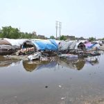 Gypsies huts submerged in rainwater at Makki Shah area.