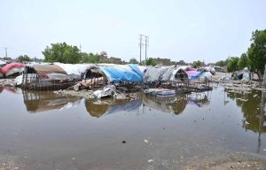Gypsies huts submerged in rainwater at Makki Shah area.