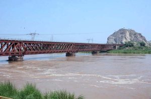 Severe flooding turned Chenab river into an ocean of raging water, flowing under the bridge, highlighting the severity of the floods in Chiniot district.
