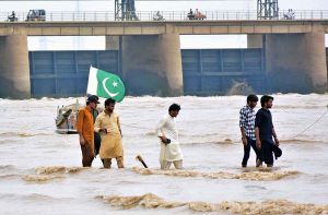 People are enjoying in the water at Indus River as water levels increased in Indus River due to heavy monsoon rain in the country.