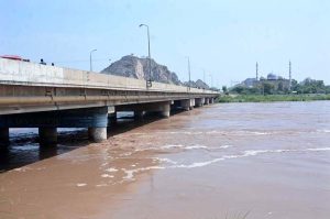 Severe flooding turned Chenab river into an ocean of raging water, flowing under the bridge, highlighting the severity of the floods in Chiniot district.