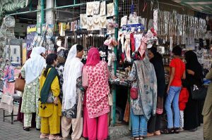 People busy purchasing onion and potatoes from vendors at weekly Sunday Bazaar, Peshawar Morr in Federal Capital