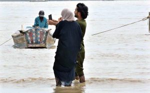 People are enjoying in the water at Indus River as water levels increased in Indus River due to heavy monsoon rain in the country.