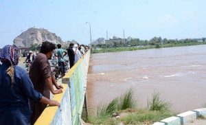 Severe flooding turned Chenab river into an ocean of raging water, flowing under the bridge, highlighting the severity of the floods in Chiniot district.