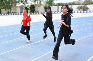 Players are in action in volleyball match during Independence Day Marka-e-Haq celebration Athletes Championship at Public School, Sports Complex.