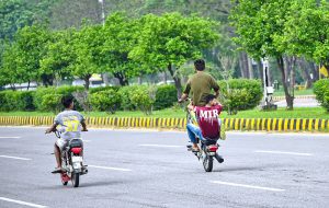 Motorcyclist riding motorcycle on one wheel at Expressway in Federal Capital may cause any mishap and needs the attention of concerned authorities.