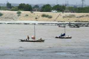 Fishermen catching the fish at Indus river.