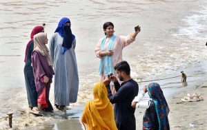 People are enjoying in the water at Indus River as water levels increased in Indus River due to heavy monsoon rain in the country.
