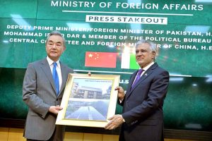 Deputy Prime Minister/Foreign Minister Senator Mohammad Ishaq Dar shakes hand with Chinese Foreign Minister Wang Yi at Ministry of Foreign Affairs.