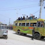 Large number of passengers traveling on rooftop of passenger bus need the attention of concerned authorities at Fateh chwok.
