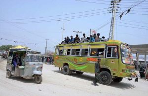 Large number of passengers traveling on rooftop of passenger bus need the attention of concerned authorities at Fateh chwok.