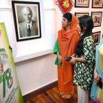 Visitors keenly viewing Quaid-e-Azam pictures during the Independence Day ceremony organized by China Window