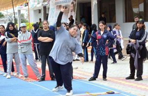 Player participate in short put throw competition during Independence Day Marka-e-Haq celebration Athletes Championship at Public School, Sports Complex.