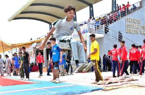 Player participate in short put throw competition during Independence Day Marka-e-Haq celebration Athletes Championship at Public School, Sports Complex.