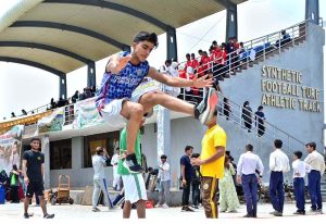 Player participate in short put throw competition during Independence Day Marka-e-Haq celebration Athletes Championship at Public School, Sports Complex.