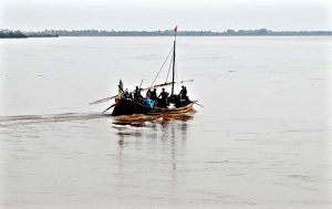 Labourers loading sand on tractor trolley at the right bank of Indus River near Aqil Village to supply to the customers.
