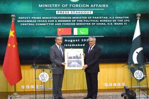 Deputy Prime Minister/Foreign Minister Senator Mohammad Ishaq Dar shakes hand with Chinese Foreign Minister Wang Yi at Ministry of Foreign Affairs.