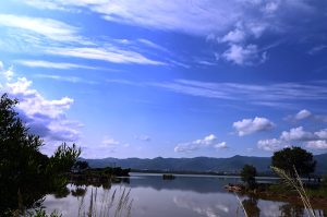 A picturesque view of clouds reflecting in the water at Rawal Dam in the Federal Capital