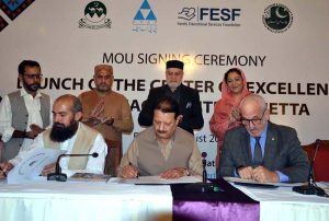 A Memorandum of Understanding (MoU) being signed between the Department of Social Welfare, Pakistan Poverty Alleviation Fund (PPAF), and Family Educational Services Foundation (FESF), as Federal Minister Syed Imran Ahmed Shah and Parliamentary Secretary Haji Wali Muhammad Noorzai witness the ceremony.