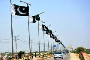 National flags installed on poles along Bypass Link Road in connection with the ‘Maarka-e-Haq’ Pakistan Independence Day celebrations.