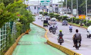 Motorcycles continue using the main road despite the Punjab government having created a special lane for them on Old Airport Road.